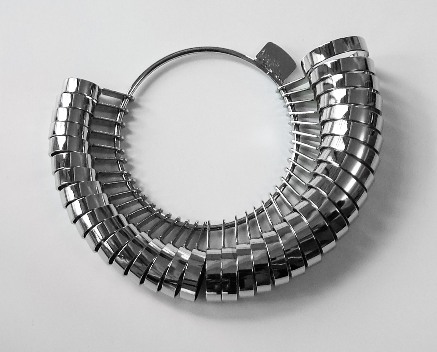 Metal finger ring sizer set used at a jewellery shop.