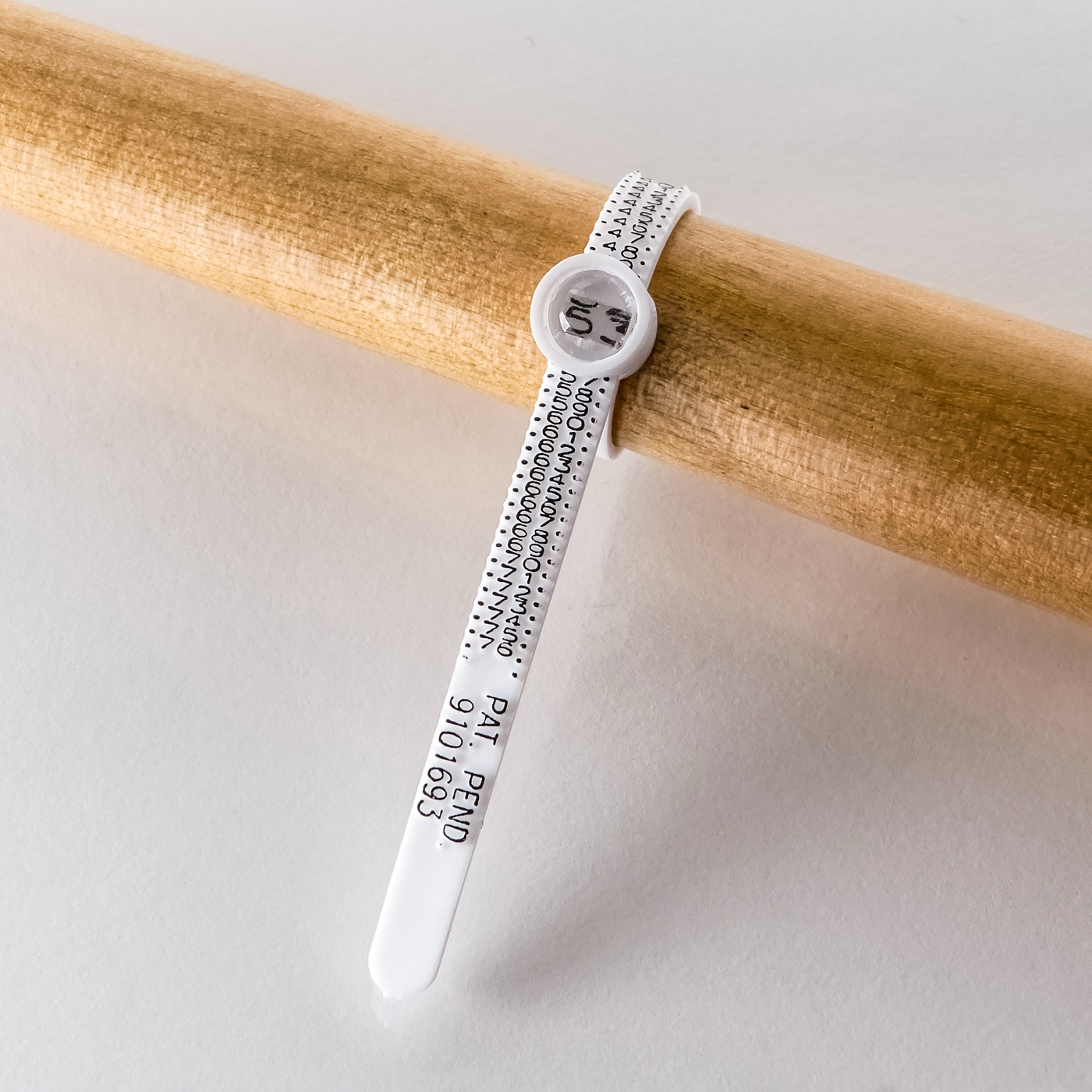 Ring sizer strip wrapped and read in millimetres.